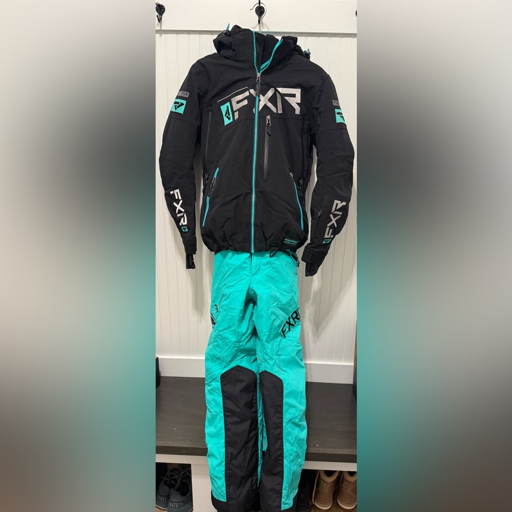 Women’s FXR insulated snowmobile suit. Jacket size 4, pants size 2